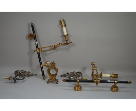 A pair of modern brass and lacquered single branch wall lights, with anglepoise arms (51cm high), a pair of white metal singl