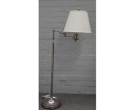 A Ralph Lauren chromed metal adjustable standard lamp with anglepoise arm, loaded circular base and a cream pleated shade, 15
