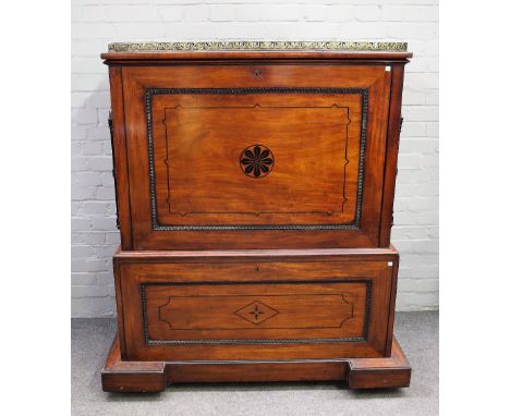 A George IV ebony inlaid mahogany folio cabinet, the pierced brass galleried top over fall front and matching opposing, revea