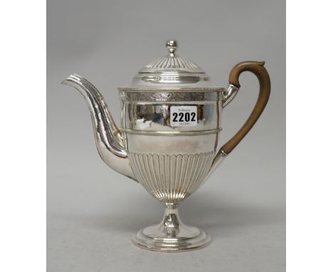 A silver plated on copper coffee pot, of Adam shaped urn form with partly fluted decoration below a foliate decorated band, r