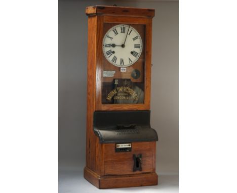 A 'National' oak cased 'clocking-in' wall clock, by National Time Recorder Co Ltd, LONDON S.E.1, 98cm high,  (one key, one pe