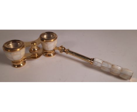 A pair of gilt brass and mother of pearl folding opera glasses.