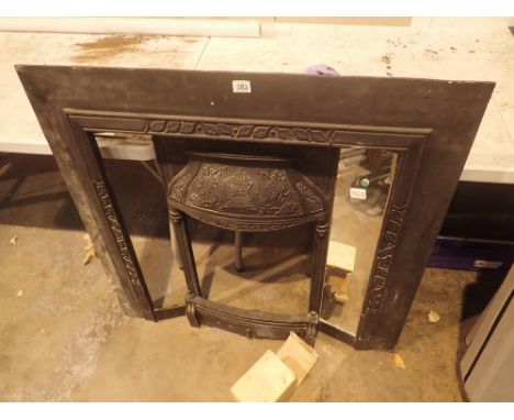 Metal fire surround with fruit and floral decoration to the border and mirror inserts to the side panels CONDITION REPORT: On