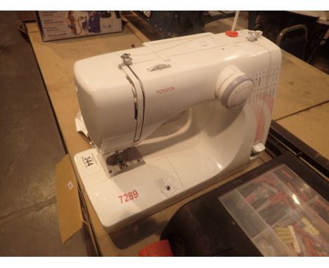 Toyota KP833 sewing machine with service receipt and instruction manual CONDITION REPORT: The electrical items included in th