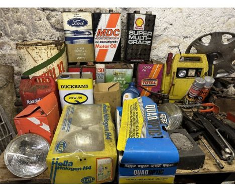 Assorted headlamps oil cans and tools (on top of the work bench)Please note:You are reminded under our Terms & Conditions of 