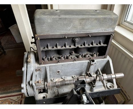 An Alvis engine on a metal stand, and in pieces, understood to be from a 1927 Alvis TG 12/50 Sports Saloon, unknown if comple