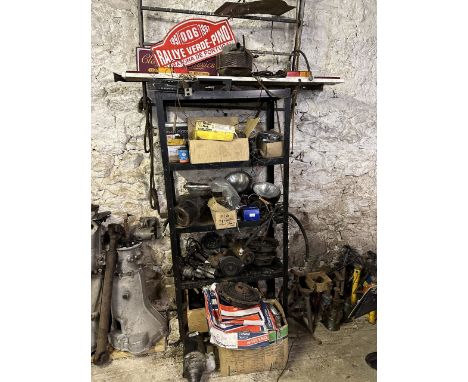 A metal shelf, with assorted items stored on it, including lamps and starter motorsPlease note:You are reminded under our Ter