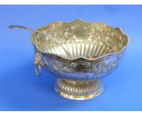 A large silver plated Punch Bowl, chased with swags of floral and foliate decoration, lion mask ring handles, on circular bas