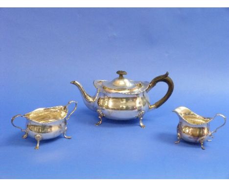 A late Victorian silver three piece Tea Set, by William Hutton, hallmarked Sheffield, 1900, of plain ovoid form with gadroone