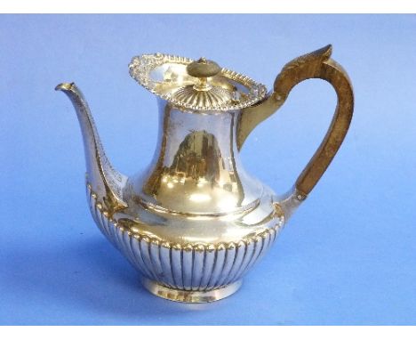 A late Victorian silver Teapot, by Sibray. Hall & Co., hallmarked London, 1895, of baluster form, with demi fluted decoration