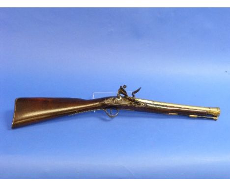 A late 18thC Blunderbuss, by Robert Walker, with 15-inch brass barrel, with maker's mark for Robert Walker and tower private 