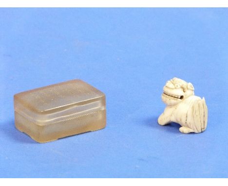 A late 19thC Japanese carved ivory Netsuke, modelled as a fu dog, damaged tail, 1?in (3.5cm) wide, together with an oriental 