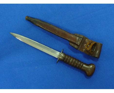 A rare W.W.2 period Dutch army fighting Knife, with 8-inch blade and original leather scabbard, overall 13in (33cm) long.