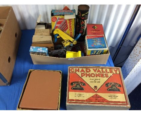 Assorted games and toys; a box of assorted toys and games, including a tinplate adding machine, pre-war Chad Valley telephone
