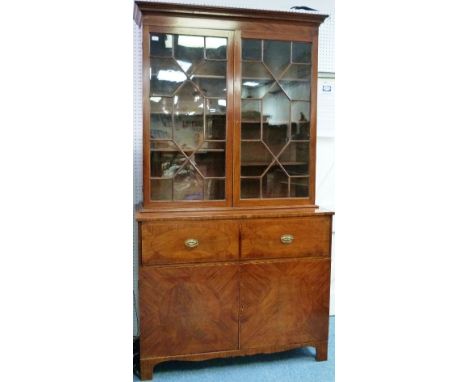 A George III mahogany secrétaire Bookcase, with ebony and boxwood stringing, the moulded cornice above a pair of astragal gla