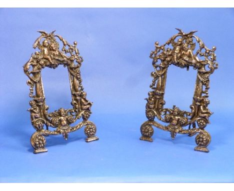 A pair of Rococo style bronzed metal easel Frames, Rd. No. 553836, of pierced architectural form, cast with foliate scrolls a