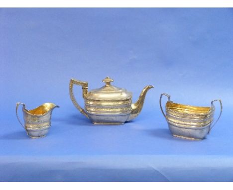 A George III Scottish silver three piece Tea Set, by Robert Keay I, hallmarked Edinburgh, 1806/7, the ovoid girdled teapot wi