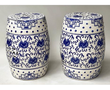 CHINESE STOOLS, a pair, Chinese blue and white ceramic barrel shaped and pierced, 46cm H. (2) 