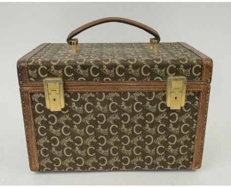 CELINE VINTAGE VANITY CASE, brass tone hardware, leather handle and trims, iconic blason pattern, leather interior and clasp 