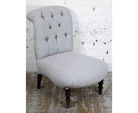 NURSING CHAIR, Victorian with ticking upholstery and ceramic castors, 76cm H x 57cm W x 71cm D. 