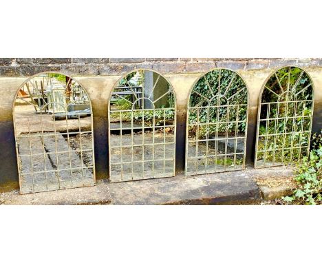 ARCHITECTURAL GARDEN WALL MIRRORS, a set of four, aged metal frames, 77cm x 49cm. (4) 