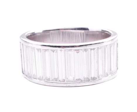 A baguette diamond-set half eternity ring, comprising a row of baguette-cut diamonds of 7.0 x 2.0 mm, with an estimated total