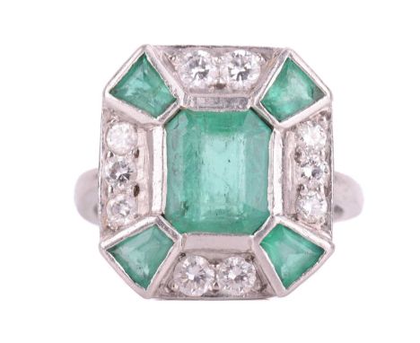 An Art Deco-style emerald and diamond panel ring in platinum, the head centred with an octagonal step-cut emerald of bright g