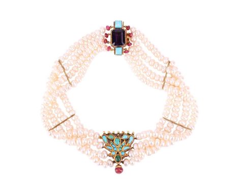 A gem set pearl choker necklace, formed of three strands of cultured pearls, measuring 32cm in length, featuring a turquoise 