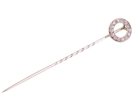 A diamond-set open circle stick pin, the annular with a milgrain edge, set with fourteen single-cut diamonds, to a tapered st