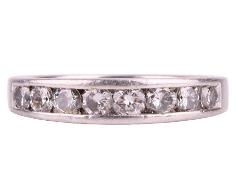 A diamond half-eternity ring in platinum, channel-set with a row of graduated brilliant-cut diamonds, with an estimated total