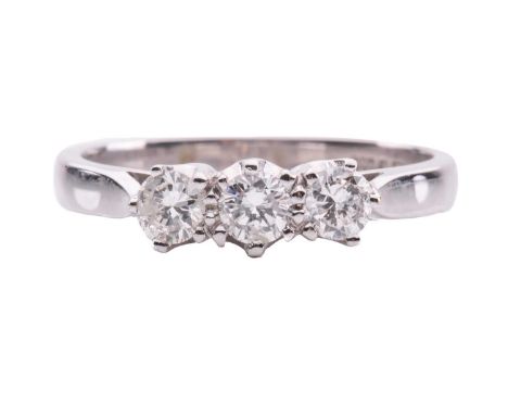 A diamond three-stone ring in 18ct white gold, coronet-set with three round brilliant-cut diamonds weighing 0.44ct in total, 