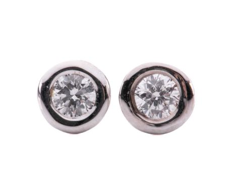 A pair of diamond stud earrings, each comprising a round brilliant-cut diamond of 3.4 mm, with an estimated weight of 0.30ct 