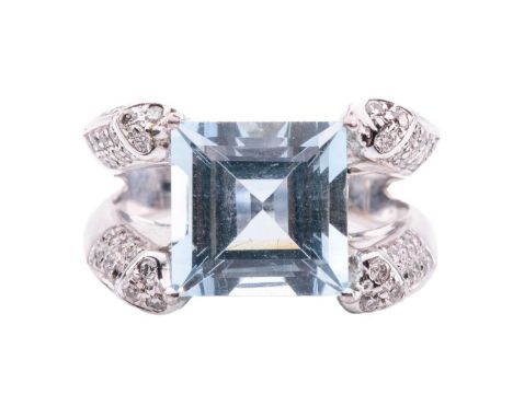 An aquamarine and diamond set cocktail ring, the square step-cut aquamarine of light blue colour approximately measures 9.8 x