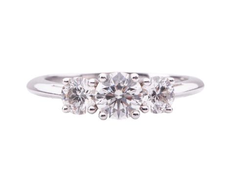 Tiffany & Co. - a diamond trilogy ring, centred with a round brilliant-cut diamond and flanked by two smaller diamonds, with 