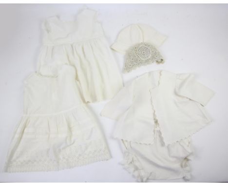 Vintage baby clothes to include: white muslin long sleeved dress with crochet insert; a white muslin long sleeved pulled thre