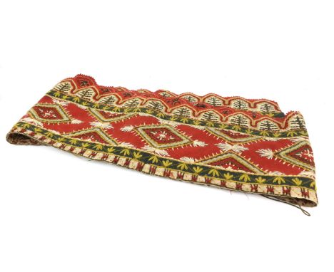An embroidered russet felt pelmet worked in wool with linen applique probably Hungry late 19th to early 20th Century 2.56 x .