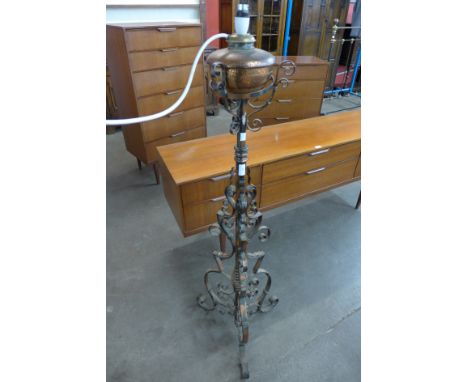 A Victorian Aesthetic Movement copper and wrought iron standard lamp