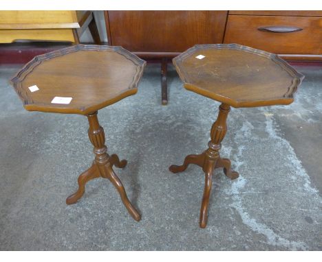 A pair of mahogany tripod wine tables