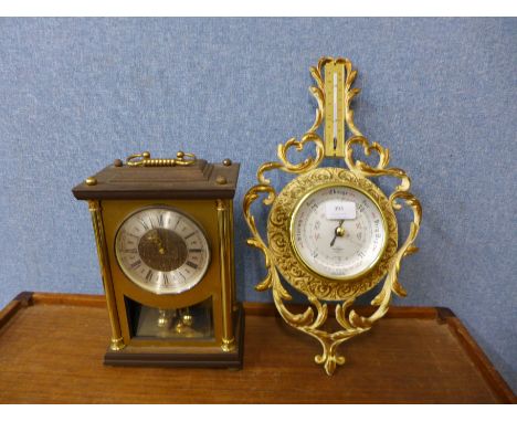 A German mantel clock and a gilt metal aneroid barometer