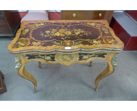 A Victorian rosewood, ormolu mounted and marquetry inlaid card table