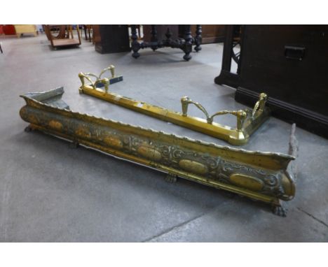 A Victorian brass fender and another