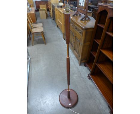 A teak standard lamp