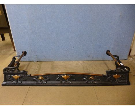 An Art Nouveau steel and copper fender