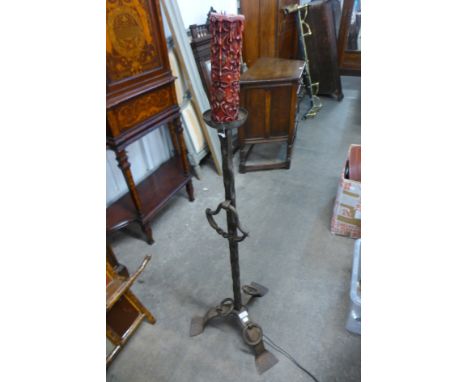 A French wrought iron standard lamp