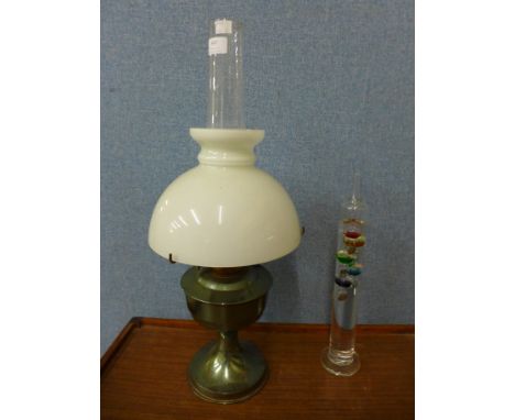 An Aladdin brass oil lamp and a glass barometer