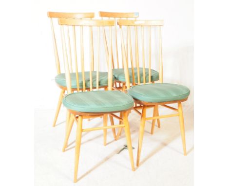 Ercol - A collection of four mid 20th century Ercol beech and elm spindle / stick back back dining bistro chairs. The chairs 
