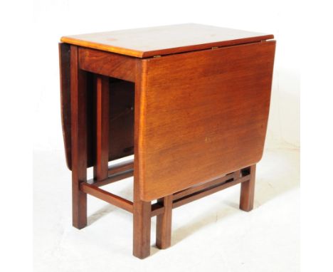 British Modern Design - A 20th century teak drop leaf gate leg extending space saving dining table. Rectangular form with squ