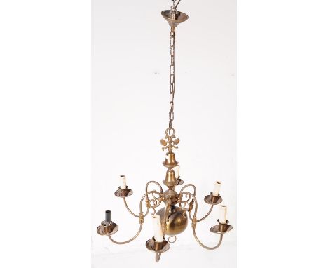A 20th century Dutch style gilt brass six branch chandelier / light fitting. Having eight scrolling branches extending from a