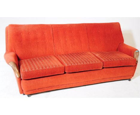 G-Plan - A mid 20th century G-Plan three seater sofa settee. The sofa upholstered in red boucle fabric, with button back desi