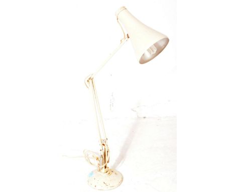 A mid 20th century industrial anglepoise factory desk / table lamp. Of metal construction with conical shade, spring loaded a